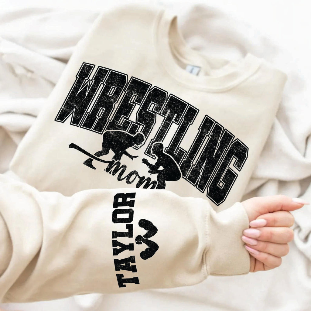 Wrestling mom on neutral with names on sleeve